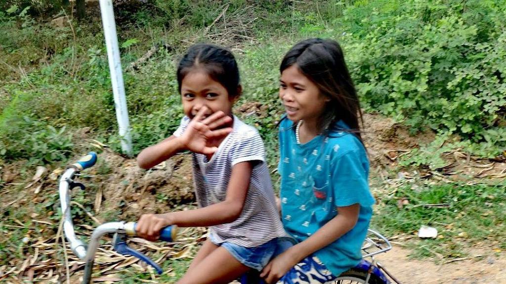 Le sourire des enfants à vélo